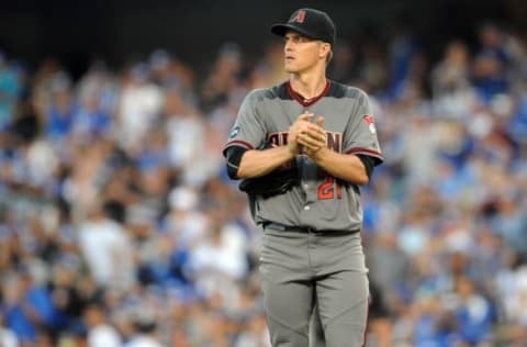 September 5, 2016; Los Angeles, CA, USA; Arizona Diamondbacks starting pitcher Zack Greinke (21) reacts after giving up a solo home run in the fifth inning against Los Angeles Dodgers third baseman Justin Turner (10) at Dodger Stadium. Mandatory Credit: Gary A. Vasquez-USA TODAY Sport