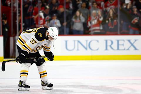 RALEIGH, NORTH CAROLINA – MAY 14: Patrice Bergeron #37 of the Boston Bruins reacts following their 2-3 loss to the Carolina Hurricanes in Game Seven of the First Round of the 2022 Stanley Cup Playoffs at PNC Arena on May 14, 2022 in Raleigh, North Carolina. (Photo by Jared C. Tilton/Getty Images)