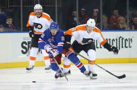 NEW YORK, NY – DECEMBER 23: Pavel Buchnevich #89 of the New York Rangers skates with the puck against Robert Hagg #8 of the Philadelphia Flyers at Madison Square Garden on December 23, 2018 in New York City. (Photo by Jared Silber/NHLI via Getty Images)