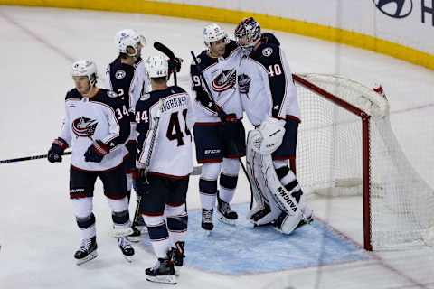 Oct 23, 2022; New York, New York, USA; Columbus Blue Jackets right wing Yegor Chinakhov (59) celebrates with Columbus Blue Jackets goaltender Daniil Tarasov (40) after defeating the New York Rangers at Madison Square Garden. Mandatory Credit: Jessica Alcheh-USA TODAY Sports