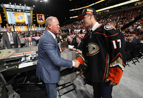 CHICAGO, IL – JUNE 24: Maxime Comtois is greeted by general manager Bob Murray of the Anaheim Ducks after being selected 50th overall by the Anaheim Ducks during the 2017 NHL Draft at United Center on June 24, 2017 in Chicago, Illinois. (Photo by Dave Sandford/NHLI via Getty Images)