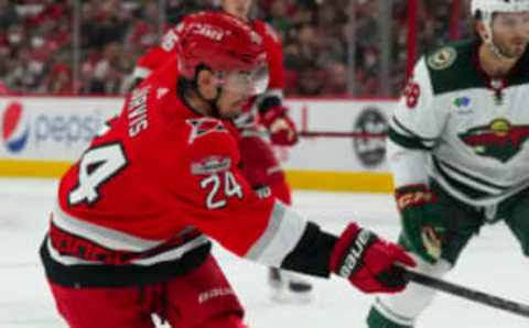 Jan 19, 2023; Raleigh, North Carolina, USA; Carolina Hurricanes center Seth Jarvis (24) takes a shot Minnesota Wild during the third period at PNC Arena. Mandatory Credit: James Guillory-USA TODAY Sports