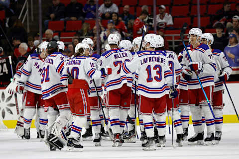 RALEIGH, NORTH CAROLINA – FEBRUARY 11: The New York Rangers celebrate their 6-2 victory over the Carolina Hurricanes following the game at PNC Arena on February 11, 2023, in Raleigh, North Carolina. (Photo by Jared C. Tilton/Getty Images)