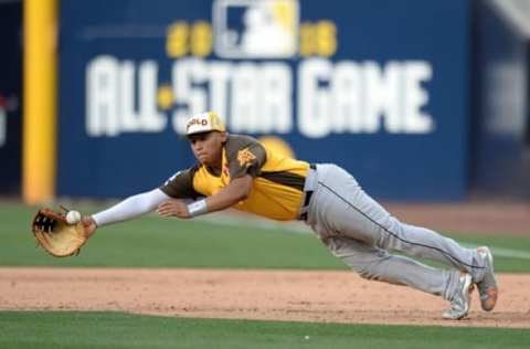 Jul 10, 2016; San Diego, CA, USA; World infielder Joosh Naylor dives for the ball during the All Star Game futures baseball game at PetCo Park. Mandatory Credit: Jake Roth-USA TODAY Sports