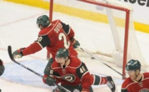 Jan 25, 2016; Saint Paul, MN, USA; Minnesota Wild defenseman Ryan Suter (20) and defenseman Jared Spurgeon (46) dive in front of the net in an attempt to block a shot by Arizona Coyotes forward Antoine Vermette (50) (not pictured). The goal ties the game during the third period at Xcel Energy Center. The Coyotes win 2-1 in an overtime shootout. Mandatory Credit: Marilyn Indahl-USA TODAY Sports