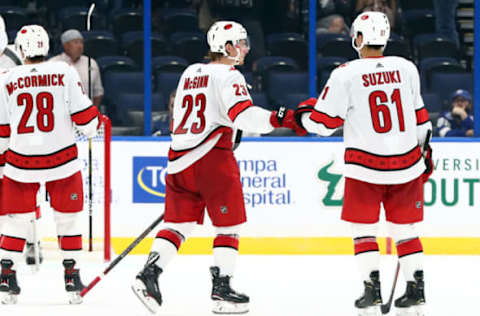 Sep 17, 2019; Tampa, FL, USA; Carolina Hurricanes left wing Brock McGinn (23) and Carolina Hurricanes forward Ryan Suzuki (61) congratulate each after they beat the Tampa Bay Lightning at Amalie Arena. Mandatory Credit: Kim Klement-USA TODAY Sports