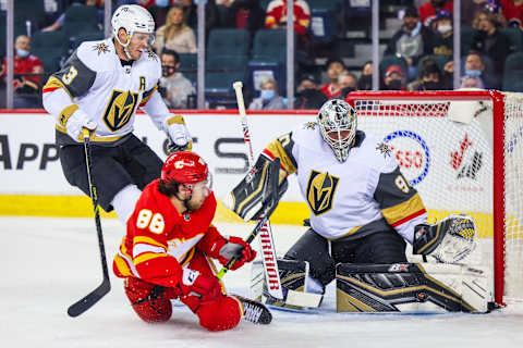 Feb 9, 2022; Calgary, Alberta, CAN; Vegas Golden Knights goaltender Robin Lehner (90) makes a save against Calgary Flames left wing Andrew Mangiapane (88) during the first period at Scotiabank Saddledome. Mandatory Credit: Sergei Belski-USA TODAY Sports