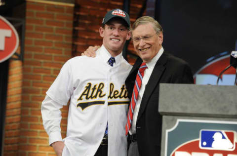 SECAUCUS, NJ – JUNE 06 : Oakland Athletics draftee Billy McKinney (L) poses for a photograph with Major League Baseball Commissioner Bud Selig at the 2013 MLB First-Year Player Draft at the MLB Network on June 6, 2013 in Secaucus, New Jersey. (Photo by Jeff Zelevansky/Getty Images)