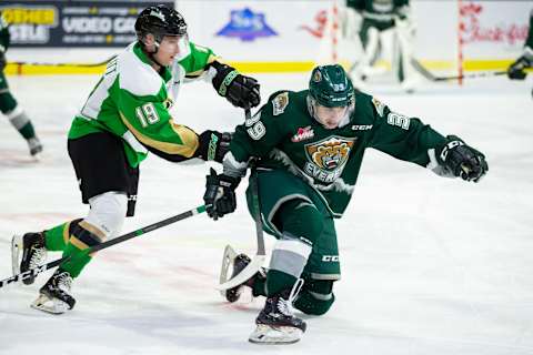 Everett Silvertips forward Gage Goncalves #39 tries to keep his balance while being pushed by Ozzy Wiesblatt #19 of the Prince Albert Raiders (Photo by Christopher Mast/Getty Images)