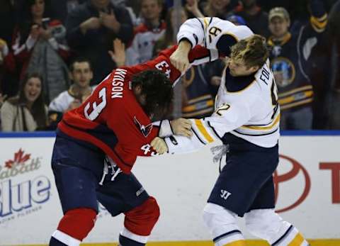 Jan 16, 2016; Buffalo, NY, USA; Buffalo Sabres left wing Marcus Foligno (82) fights Washington Capitals right wing Tom Wilson (43) during the third period at First Niagara Center. Sabres beat the Capitals 4-1. Mandatory Credit: Kevin Hoffman-USA TODAY Sports