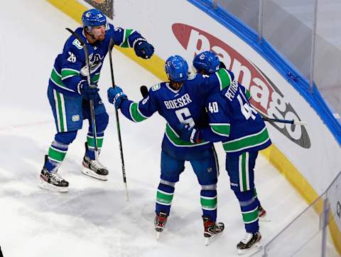 The Vancouver Canucks celebrate a second-period goal by Elias Pettersson #40 (Photo by Jeff Vinnick/Getty Images)