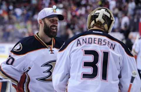 Apr 11, 2015; Glendale, AZ, USA; Anaheim Ducks goalie Frederik Andersen (31) celebrates with goalie Jason LaBarbera (30) after beating the Arizona Coyotes 2-1 at Gila River Arena. Mandatory Credit: Matt Kartozian-USA TODAY Sports