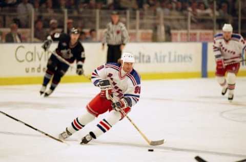 25 Nov 1997: Center Wayne Gretzky of the New York Rangers skates down the ice during a game against the Vancouver Canucks at Madison Square Garden in New York City, New York. The Canucks won the game 4-2.