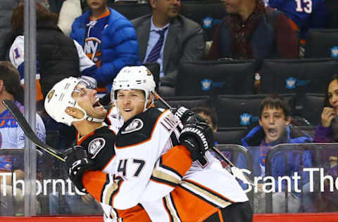 NEW YORK, NY: Hampus Lindholm #47 of the Anaheim Ducks celebrates his overtime game-winning goal against the New York Islanders with teammate Ryan Getzlaf #15 following a 5-4 win at Barclays Center on December 21, 2017. (Photo by Mike Stobe/NHLI via Getty Images)