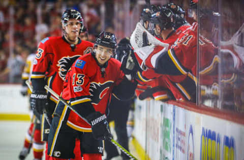 Mar 13, 2017; Calgary, Alberta, CAN; Calgary Flames left wing Johnny Gaudreau (13) celebrates his goal with teammates against the Pittsburgh Penguins during the third period at Scotiabank Saddledome. Calgary Flames won 4-3. Mandatory Credit: Sergei Belski-USA TODAY Sports