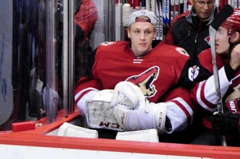 Feb 18, 2016; Glendale, AZ, USA; Arizona Coyotes goalie Niklas Treutle (60) looks on prior to the game against the Dallas Stars at Gila River Arena. Mandatory Credit: Matt Kartozian-USA TODAY Sports