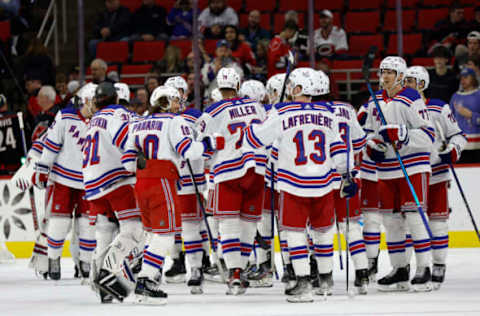 RALEIGH, NORTH CAROLINA – FEBRUARY 11: The New York Rangers celebrate their 6-2 victory over the Carolina Hurricanes following the game at PNC Arena on February 11, 2023, in Raleigh, North Carolina. (Photo by Jared C. Tilton/Getty Images)