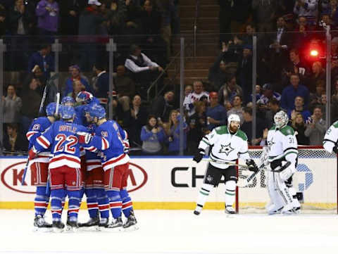 Jan 5, 2016; New York, NY, USA; New York Rangers defenseman Keith Yandle (L) is congratulated by his teammates after scoring a goal against the Dallas Stars during the first period at Madison Square Garden. Mandatory Credit: Andy Marlin-USA TODAY Sports