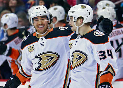 VANCOUVER, BC – MARCH 26: Sam Steel #34 of the Anaheim Ducks is congratulated by teammate Kiefer Sherwood #64 after scoring during their NHL game against the Vancouver Canucks at Rogers Arena March 26, 2019, in Vancouver, British Columbia, Canada. (Photo by Jeff Vinnick/NHLI via Getty Images)