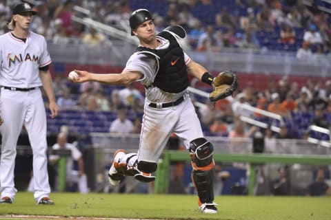 MIAMI, FL – JULY 15: J.T. Realmuto #11 of the Miami Marlins throws towards first base during the eighth inning against the Philadelphia Phillies at Marlins Park on July 15, 2018 in Miami, Florida. (Photo by Eric Espada/Getty Images)