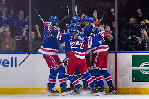 Nov 14, 2021; New York, New York, USA; New York Rangers celebrate the goal by New York Rangers left wing Alexis Lafreniere (13) against the New Jersey Devils during the second period at Madison Square Garden. Mandatory Credit: Dennis Schneidler-USA TODAY Sports