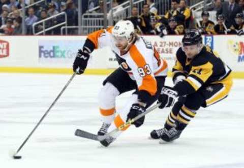 Jan 21, 2016; Pittsburgh, PA, USA; Philadelphia Flyers right wing Jakub Voracek (93) skates with he puck as Pittsburgh Penguins center Kevin Porter (11) defends during the second period at the CONSOL Energy Center. Mandatory Credit: Charles LeClaire-USA TODAY Sports