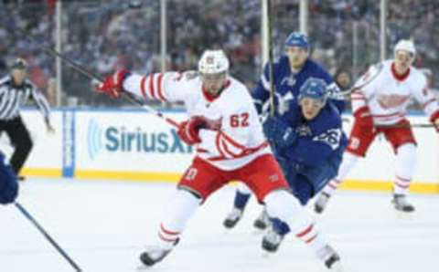 NHL Trade Deadline: Detroit Red Wings left wing Thomas Vanek (62) shoots as Toronto Maple Leafs right wing Nikita Soshnikov (26) gives chase during the Centennial Classic ice hockey game at BMO Field. Mandatory Credit: Tom Szczerbowski-USA TODAY Sports