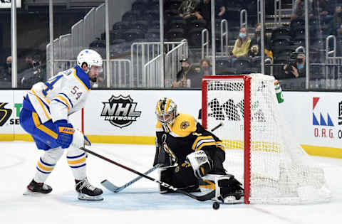 May 1, 2021; Boston, Massachusetts, USA; Boston Bruins goaltender Jeremy Swayman (1) makes a save on Buffalo Sabres defenseman Mattias Samuelsson (54) during the first period at TD Garden. Mandatory Credit: Bob DeChiara-USA TODAY Sports