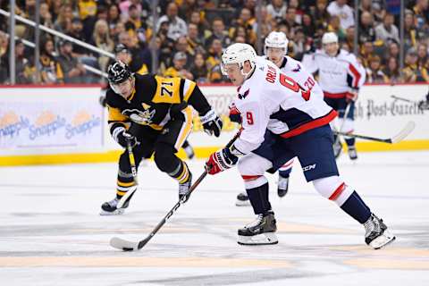 PITTSBURGH, PA – OCTOBER 04: Washington Capitals Defenseman Dmitry Orlov (9) skates the puck through center ice during the third period in the NHL game between the Pittsburgh Penguins and the Washington Capitals on October 4, 2018, at PPG Paints Arena in Pittsburgh, PA. The Penguins defeated the Capitals 7-6 in overtime. (Photo by Jeanine Leech/Icon Sportswire via Getty Images)