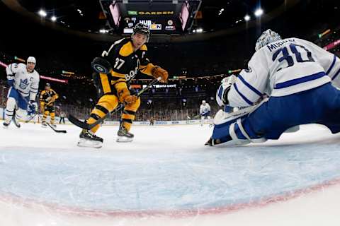 Jan 14, 2023; Boston, Massachusetts, USA; Boston Bruins center Patrice Bergeron (37) deflects a pass past Toronto Maple Leafs goaltender Matt Murray (30) for a goal during the first period at TD Garden. Mandatory Credit: Winslow Townson-USA TODAY Sports