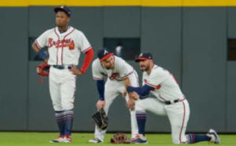 ATLANTA, GA JULY 26: Braves outfielders Ronald Acuna (left), Ender Inciarte (center), and Nick Markakis (right) take a break during a pitching change during the game between Atlanta and Los Angeles on July 26th, 2018 at SunTrust Park in Atlanta, GA. The Los Angeles Dodgers beat the Atlanta Braves by a score of 8 2. (Photo by Rich von Biberstein/Icon Sportswire via Getty Images)