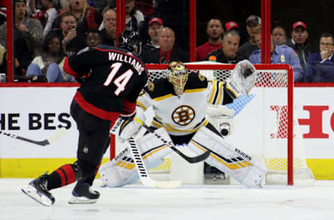 Tuukka Rask #40 of the Boston Bruins makes a glove save shot by Justin Williams #14 of the Carolina Hurricanes  (Photo by Bruce Bennett/Getty Images)