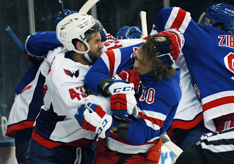 NEW YORK, NEW YORK – MAY 03: Tom Wilson #43 of the Washington Capitals takes a roughing penalty during the second period against Artemi Panarin #10 of the New York Rangers at Madison Square Garden on May 03, 2021 in New York City. (Photo by Bruce Bennett/Getty Images)