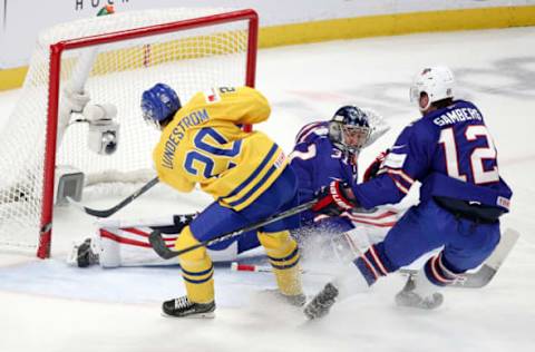 BUFFALO, NY – JANUARY 04: Anaheim Ducks 1st round pick Isac Lundeström #20 of Sweden shoots the puck just wide of the net after skating past Dylan Samberg #12 and Joseph Woll #31 of United States during the IIHF World Junior Championships. (Photo by Nicholas T. LoVerde/Getty Images)