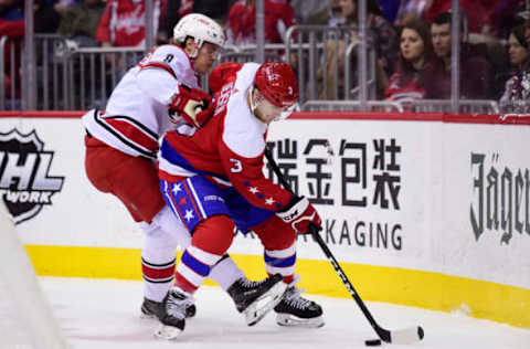 WASHINGTON, DC – MARCH 26: Nick Jensen #3 of the Washington Capitals controls the puck against Saku Maenalanen #8 of the Carolina Hurricanes in the second period at Capital One Arena on March 26, 2019 in Washington, DC. (Photo by Patrick McDermott/NHLI via Getty Images)