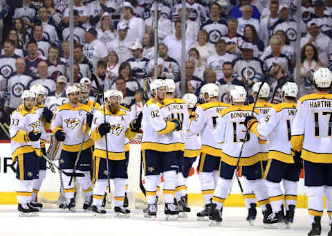 WINNIPEG, MB – MAY 3: Nashville Predators players stream onto the ice to celebrate a 2-1 victory over the Winnipeg Jets in Game Four of the Western Conference Second Round during the 2018 NHL Stanley Cup Playoffs at the Bell MTS Place on May 3, 2018 in Winnipeg, Manitoba, Canada. The series is tied 2-2. (Photo by Darcy Finley/NHLI via Getty Images)