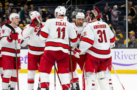 BOSTON, MA – FEBRUARY 10: Frederik Andersen #31 of the Carolina Hurricanes celebrates a 6-0 victory against the Boston Bruins with his teammates Jordan Staal #11, Nino Niederreiter #21, and Brett Pesce #22 at the TD Garden on February 10, 2022, in Boston, Massachusetts. (Photo by Rich Gagnon/Getty Images)