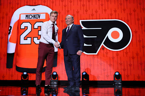 Matvei Michkov greets NHL commissioner Gary Bettman after being drafted by the Flyers. (Photo by Bruce Bennett/Getty Images)