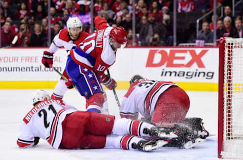 WASHINGTON, DC – MARCH 26: Petr Mrazek #34 of the Carolina Hurricanes makes a save against Brett Connolly #10 of the Washington Capitals in the first period at Capital One Arena on March 26, 2019 in Washington, DC. (Photo by Patrick McDermott/NHLI via Getty Images)