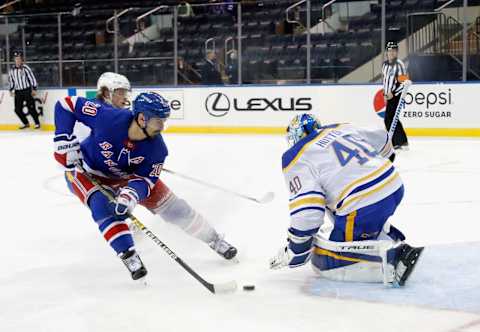 NEW YORK, NEW YORK – MARCH 02:Sabres makes the third period save on Chris Kreider #20 of the New York Rangers (Photo by Bruce Bennett/Getty Images)