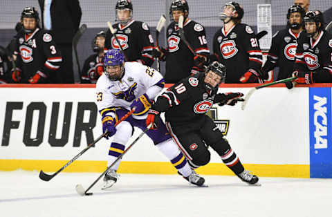 St. Cloud State’s Nolan Walker tries to get the puck past Jake Livingstone of MSU-Mankato during the NCAA Frozen Four semifinals Thursday, April 8, 2021, in Pittsburgh.Scsu Hock 4