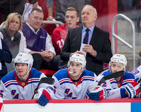 DETROIT, MI – DECEMBER 29: Assistant coach Lindy Ruff of the New York Rangers watches the action from the bench against the Detroit Red Wings during an NHL game at Little Caesars Arena on December 29, 2017 in Detroit, Michigan. The Wings defeated the Rangers 3-2 in a shootout. (Photo by Dave Reginek/NHLI via Getty Images)