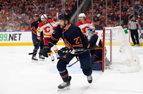 Brett Kulak #27 of the Edmonton Oilers defends against the Calgary Flames during playoffs (Photo by Codie McLachlan/Getty Images)