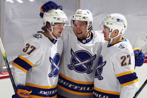 NEWARK, NEW JERSEY – MARCH 16: Jeff Skinner #53 of the Buffalo Sabres (c) celebrates his goal at 7:10 of the second period against the New Jersey Devils and is joined by Casey Mittelstadt #37 (l) and Curtis Lazar #27 (r) at the Prudential Center on March 16, 2021 in Newark, New Jersey. (Photo by Bruce Bennett/Getty Images)