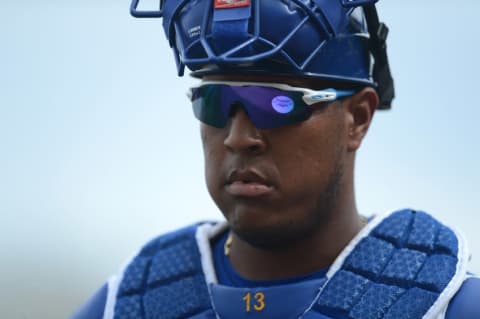 Mar 5, 2016; Surprise, AZ, USA; Kansas City Royals catcher Salvador Perez (13) looks on during the fourth inning against the Chicago White Sox at Surprise Stadium. Mandatory Credit: Joe Camporeale-USA TODAY Sports