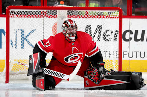 RALEIGH, NC – JANUARY 14: Scott Darling #33 of the Carolina Hurricanes stretches in the crease prior to an NHL game against the Calgary Flames on January 14, 2018 at PNC Arena in Raleigh, to an North Carolina. (Photo by Gregg Forwerck/NHLI via Getty Images)