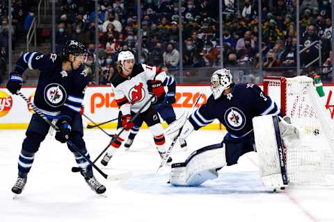 New Jersey Devils defenseman Damon Severson (28) (out of photo) scores on Winnipeg Jets goaltender Connor Hellebuyck (37) Mandatory Credit: James Carey Lauder-USA TODAY Sports