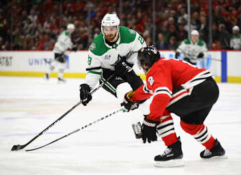 CHICAGO, IL – FEBRUARY 08: Stephen Johns #28 of the Dallas Stars advances the puck against Duncan Keith #2 of the Chicago Blackhawks chase the puck at the United Center on February 8 2018 in Chicago, Illinois. (Photo by Jonathan Daniel/Getty Images)