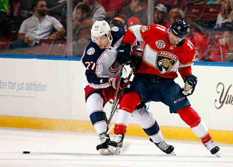 SUNRISE, FL – OCTOBER 11: Jonathan Huberdeau #11 of the Florida Panthers skates for possession against Josh Anderson #77 of the Columbus Blue Jackets at the BB&T Center on October 11, 2018 in Sunrise, Florida. (Photo by Eliot J. Schechter/NHLI via Getty Images)