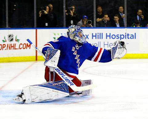 Nov 29, 2016; New York, NY, USA; New York Rangers goaltender Henrik Lundqvist (30) makes a glove save against the Carolina Hurricanes during the third period at Madison Square Garden. The rangers won 3-2. Mandatory Credit: Andy Marlin-USA TODAY Sports